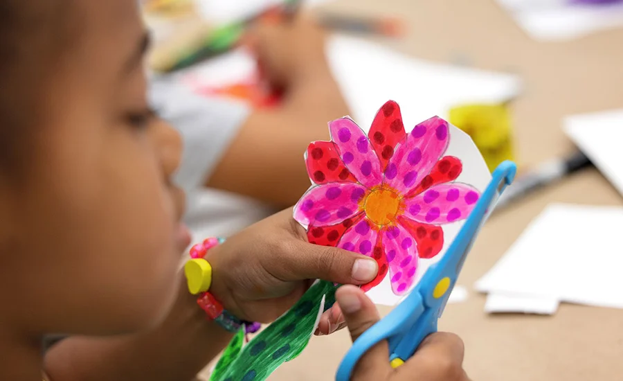 Young students working on colorful artwork