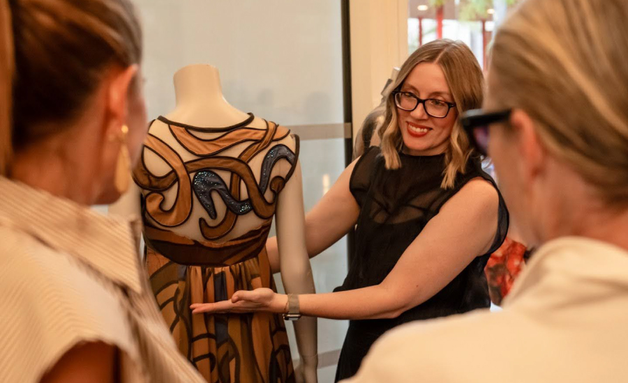 Erin Bond presents a design she made for the Wear LACMA mentor project that was later purchased in a silent auction and worn to a LACMA gala. Photograph by Andre Hylton. 