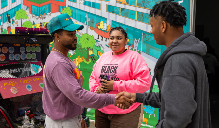 Nikkolos Mohammed (’13 BFA Fine Arts), left, hosted an event for BCI and FirstGen First Flight with DREAMHAUS LA, the nonprofit art collective he co-founded with Mike Reesé (’13 BFA Communication Arts). Photograph by Brian Feinzimer