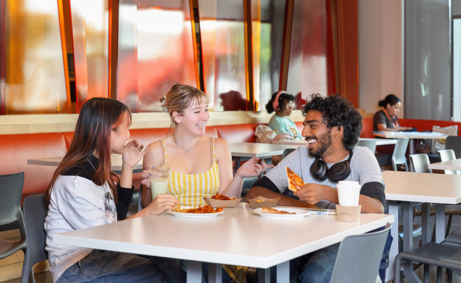 Students eat and gather in the dining hall.
