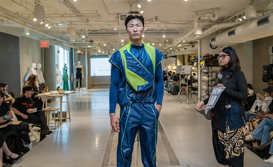 Model wearing Surah Koticha's design during a fitting with mentors from Nike