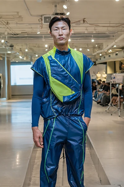 Model wearing Surah Koticha's design during a fitting with mentors from Nike