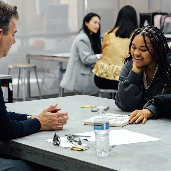 Student and mentor reviewing portfolio