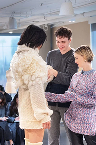 Mentor Ida Lamberton, right, head of women’s ready-to-wear at clothing brand FRAME, during a fitting session with Otis College Fashion Design students