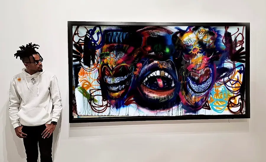 Recent graduate Olivier Ganthier with a work from his MFA thesis exhibition.