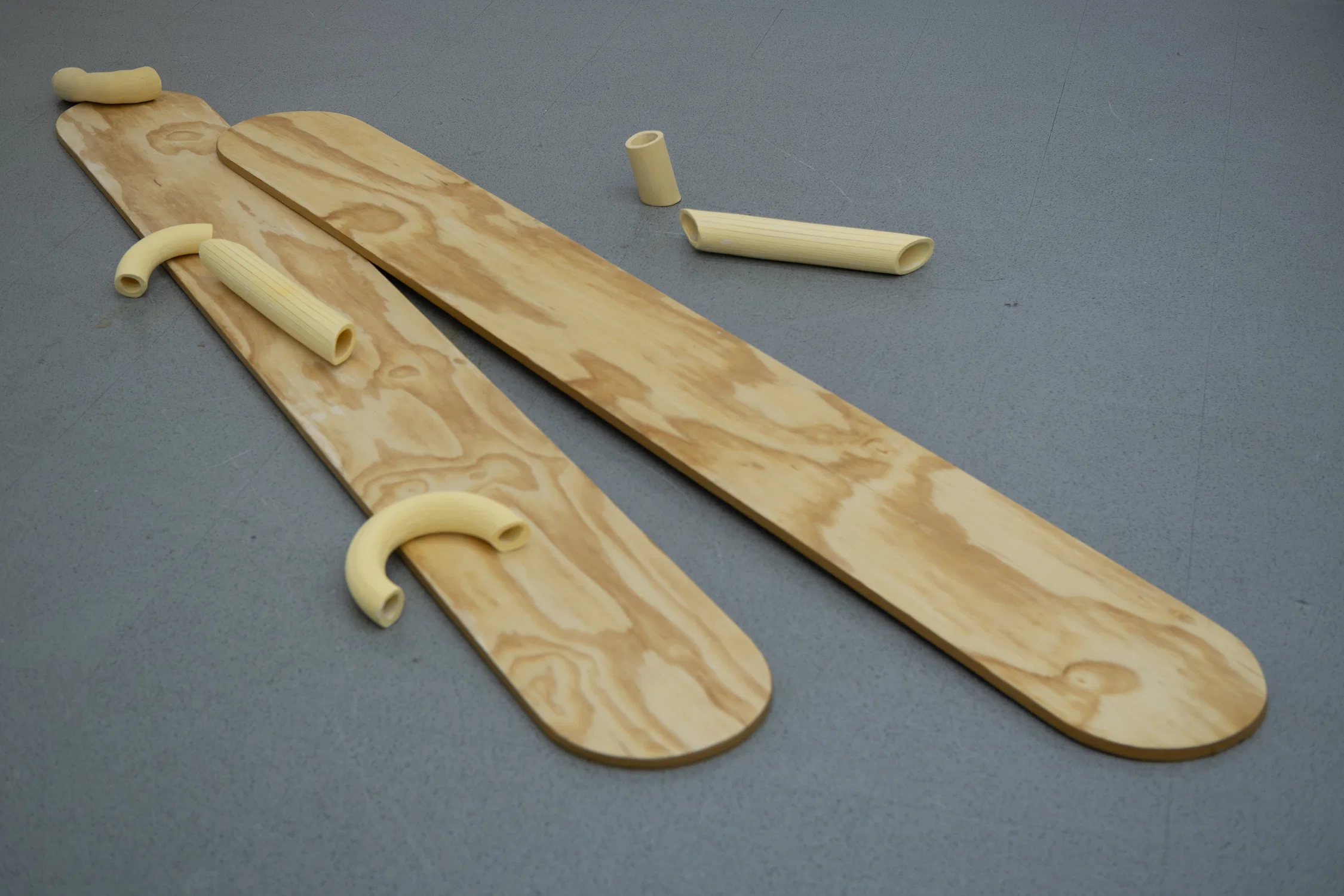 enlarged popsicle stick and ceramic pasta