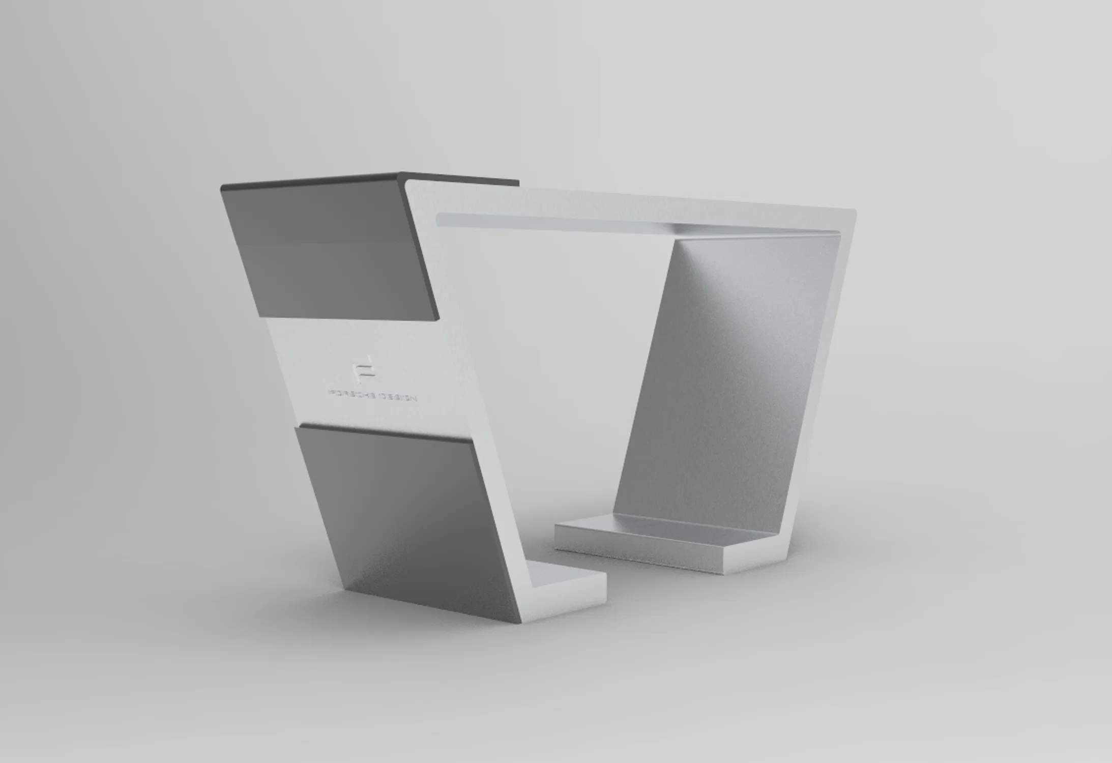 A sleek concept table by Porsche Design, featuring bold angles and a minimal, aerodynamic form that echoes the brand’s high-performance aesthetic.
