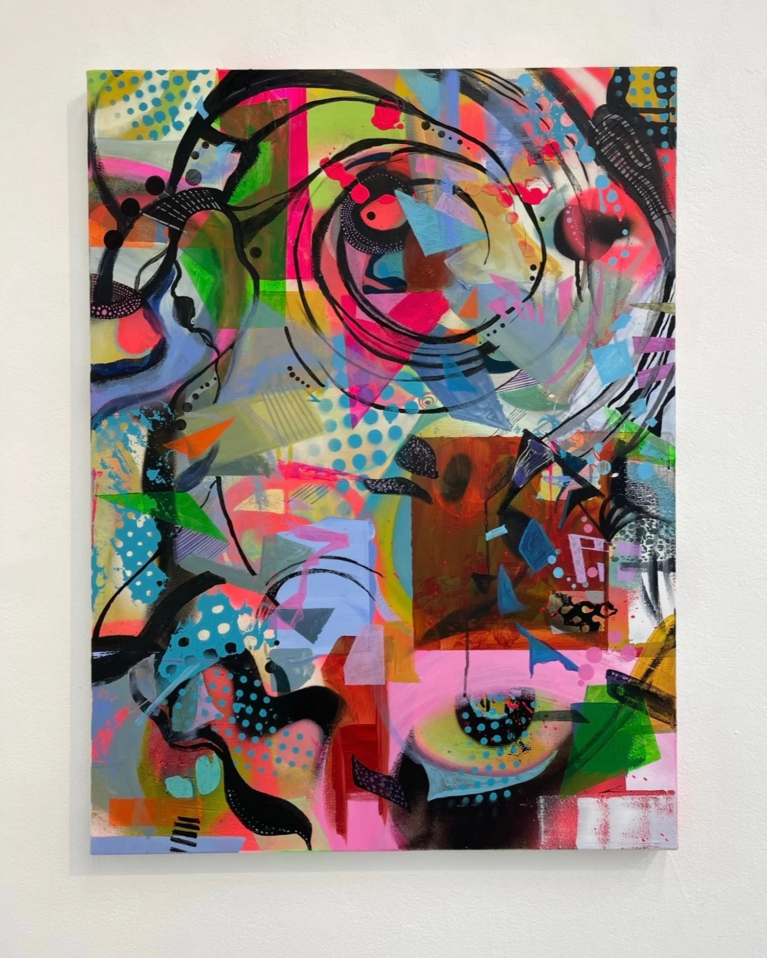 An abstract painting composed of different shapes, colors and textures. It was made mostly with neon spray paints and stencils, but there are smaller elements of freehanded detail work present as well.