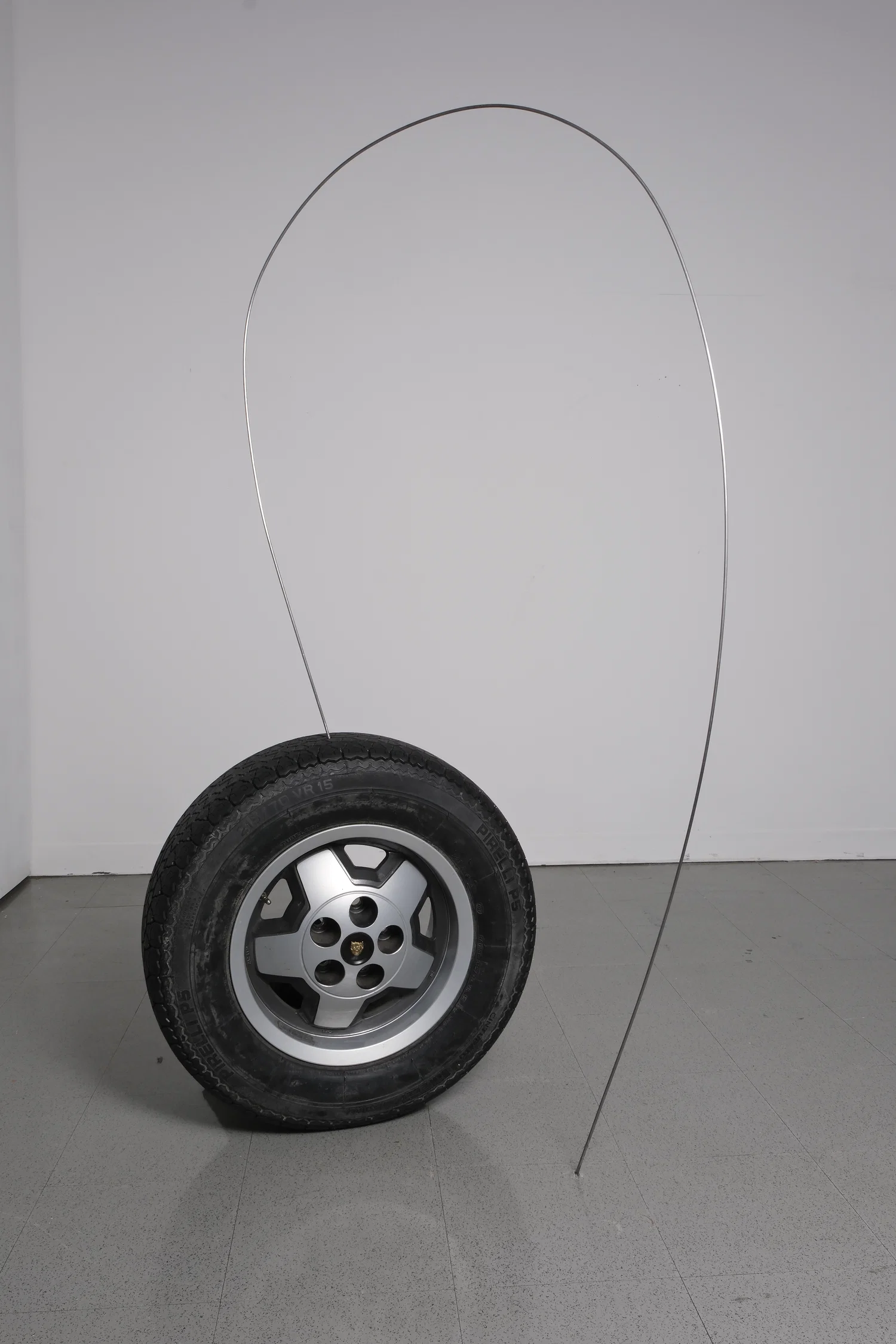 spare tire propped up with long 10 ft nail