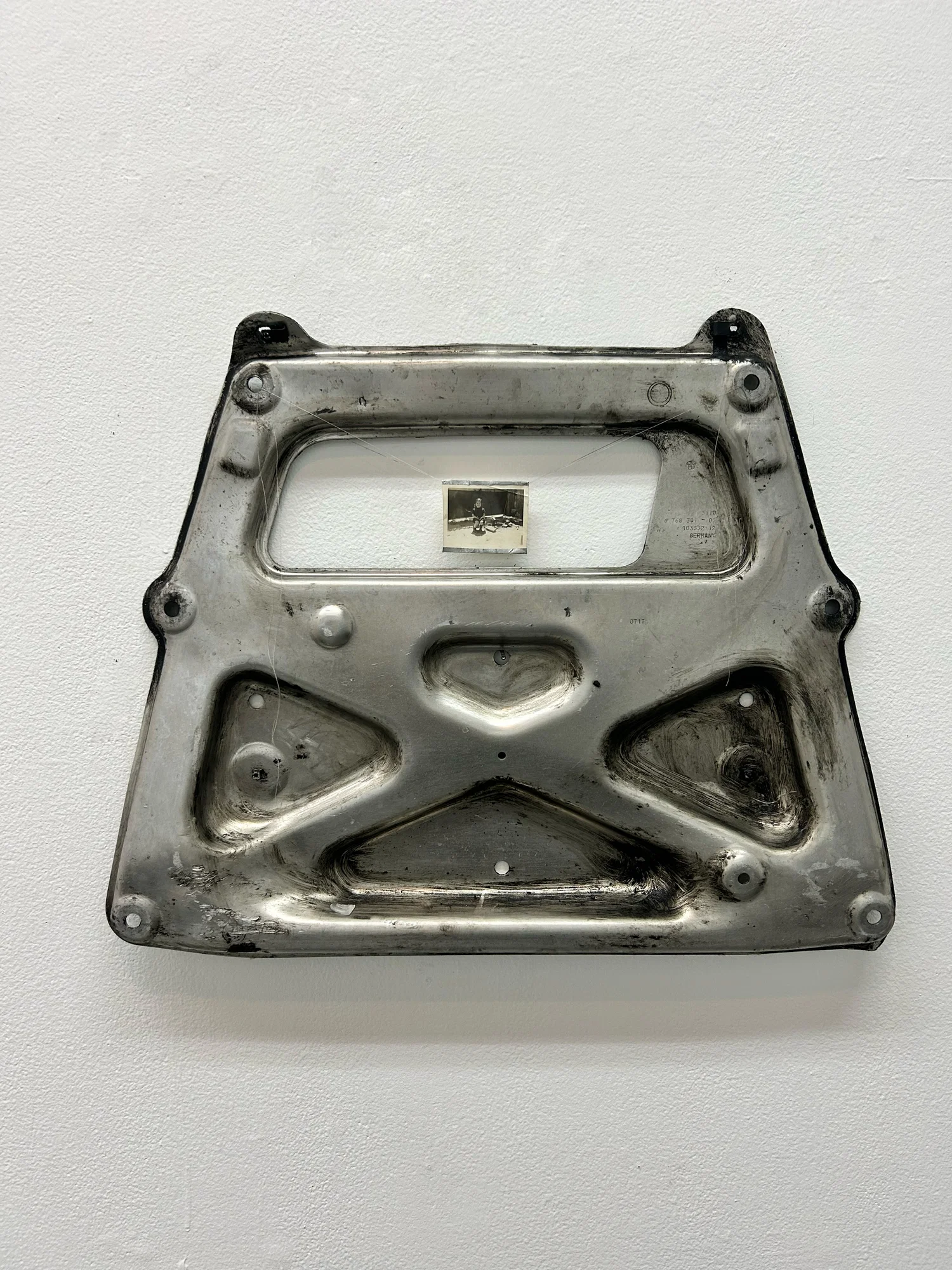 greasy metal car part framing small image