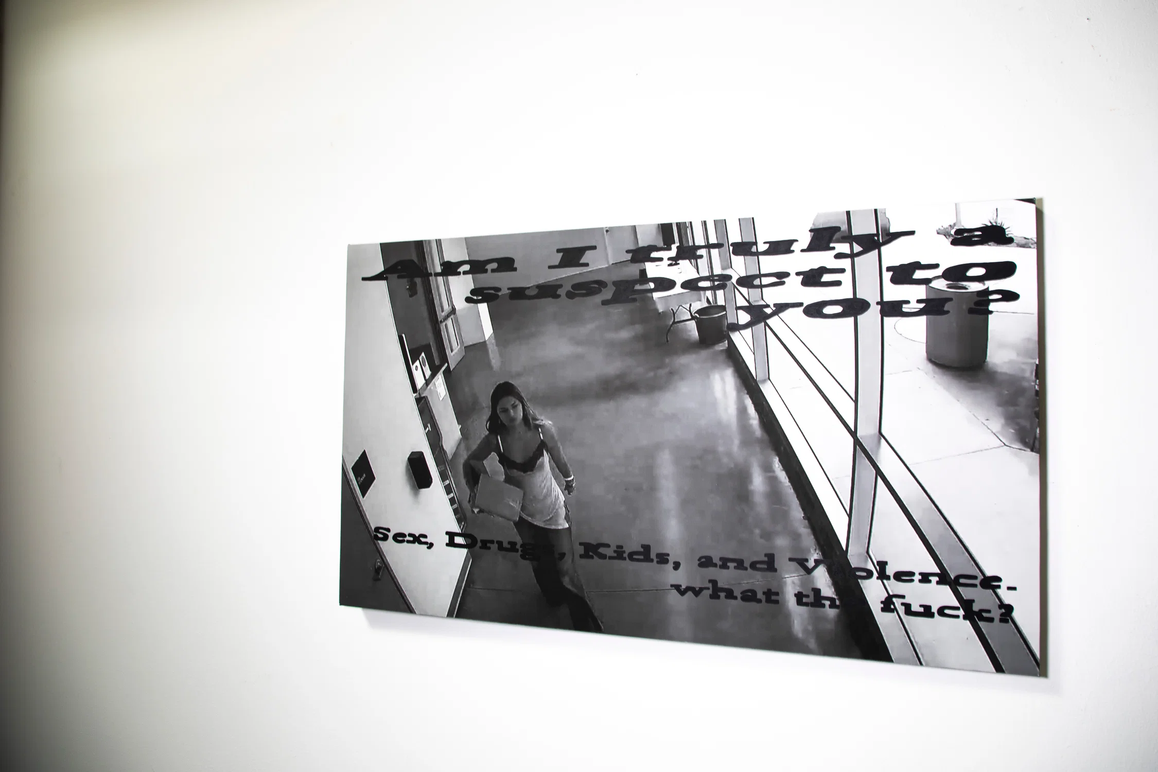 A image stretched on canvas, pulled from security camera footage. Text overlays the image.