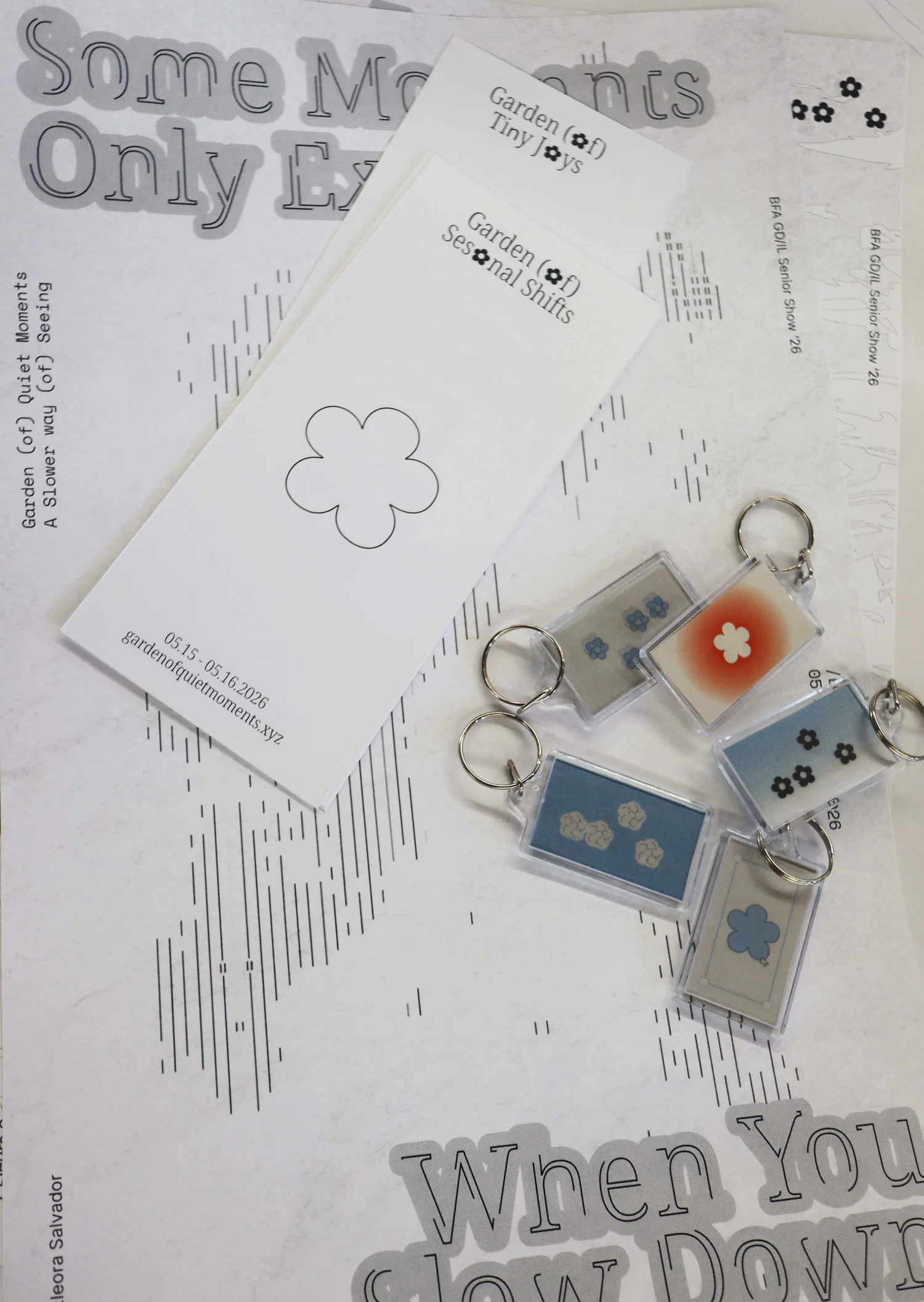 This image has a poster, cards, and keychains as my physical deliverables for my senior show project.