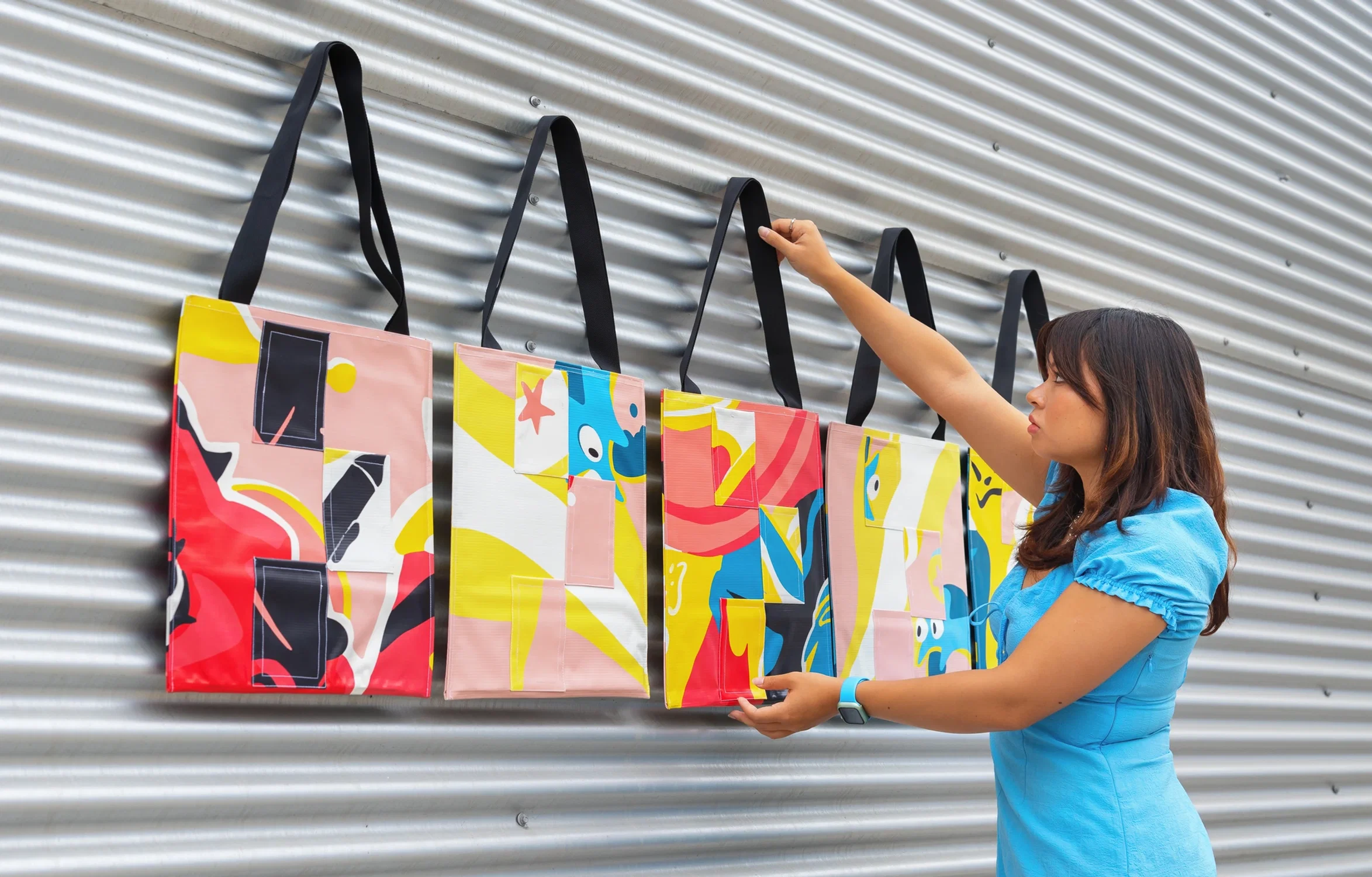 Tote bags made in collaboration with Otis's Design Lab. They are made of reused Otis pole banners.
