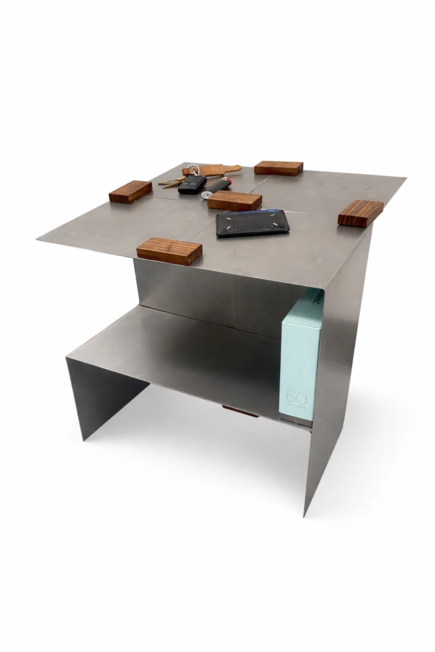 A modular side table system that rethinks fixed furniture by allowing users to shape their own configuration. Simple L-shaped units connect through magnets to be rotated, stacked, and repeated, creating flexible compositions that adapt to changing spaces.