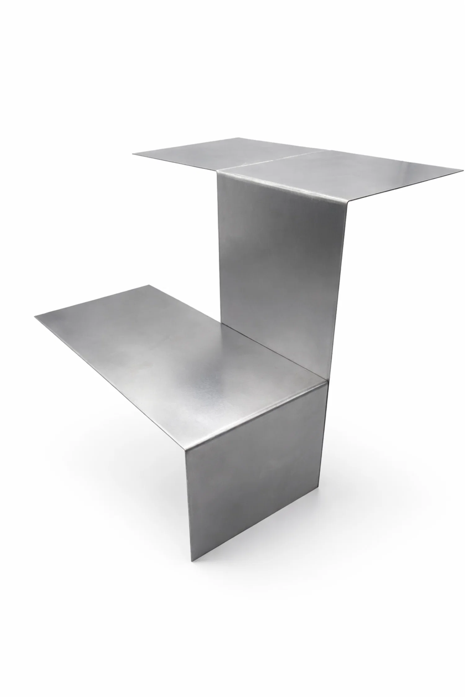 A modular side table system that rethinks fixed furniture by allowing users to shape their own configuration. Simple L-shaped units connect through magnets to be rotated, stacked, and repeated, creating flexible compositions that adapt to changing spaces.