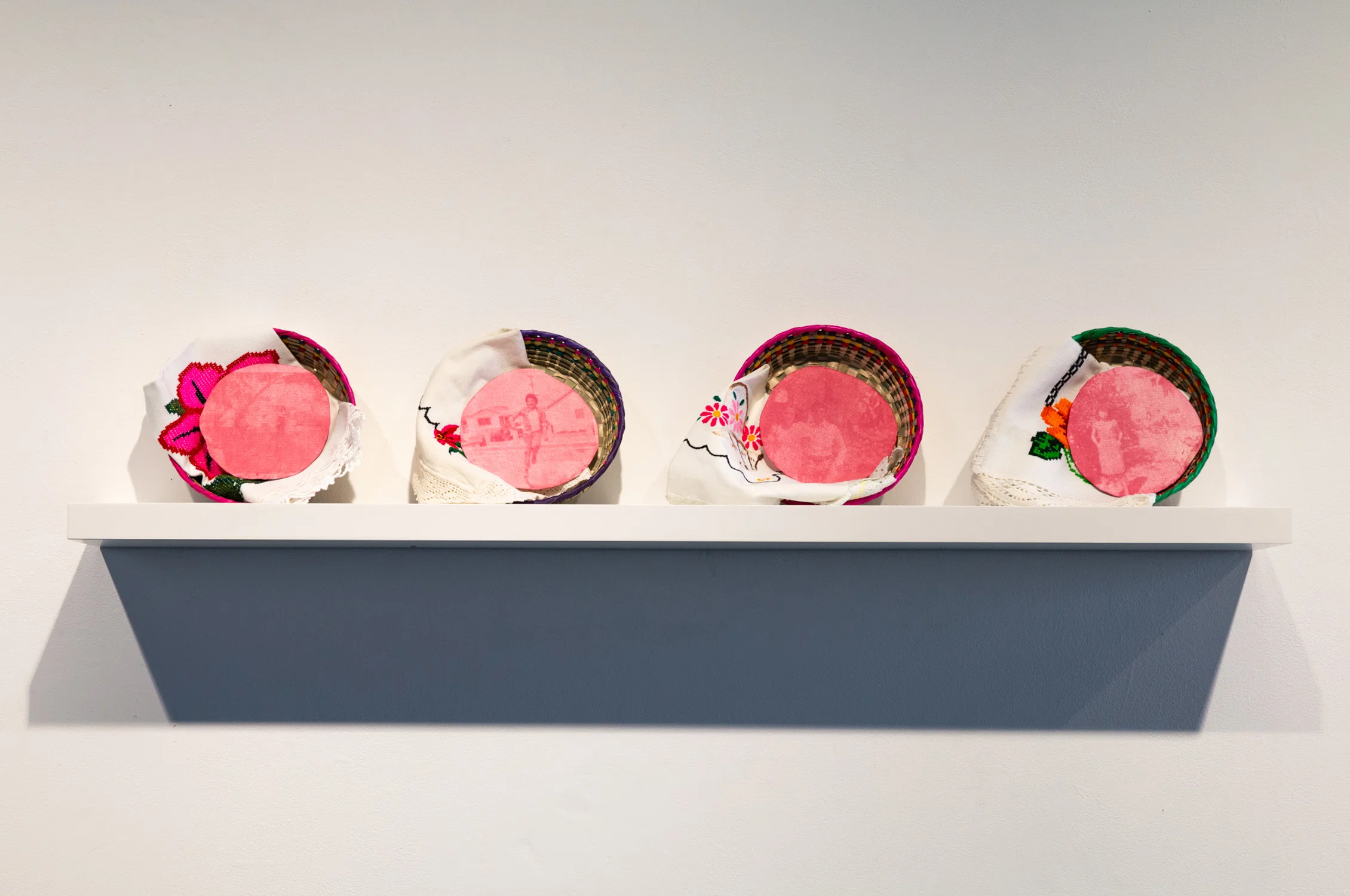 Installation of tortillas, using beetroot juice and displayed in tortilla warmer baskets.