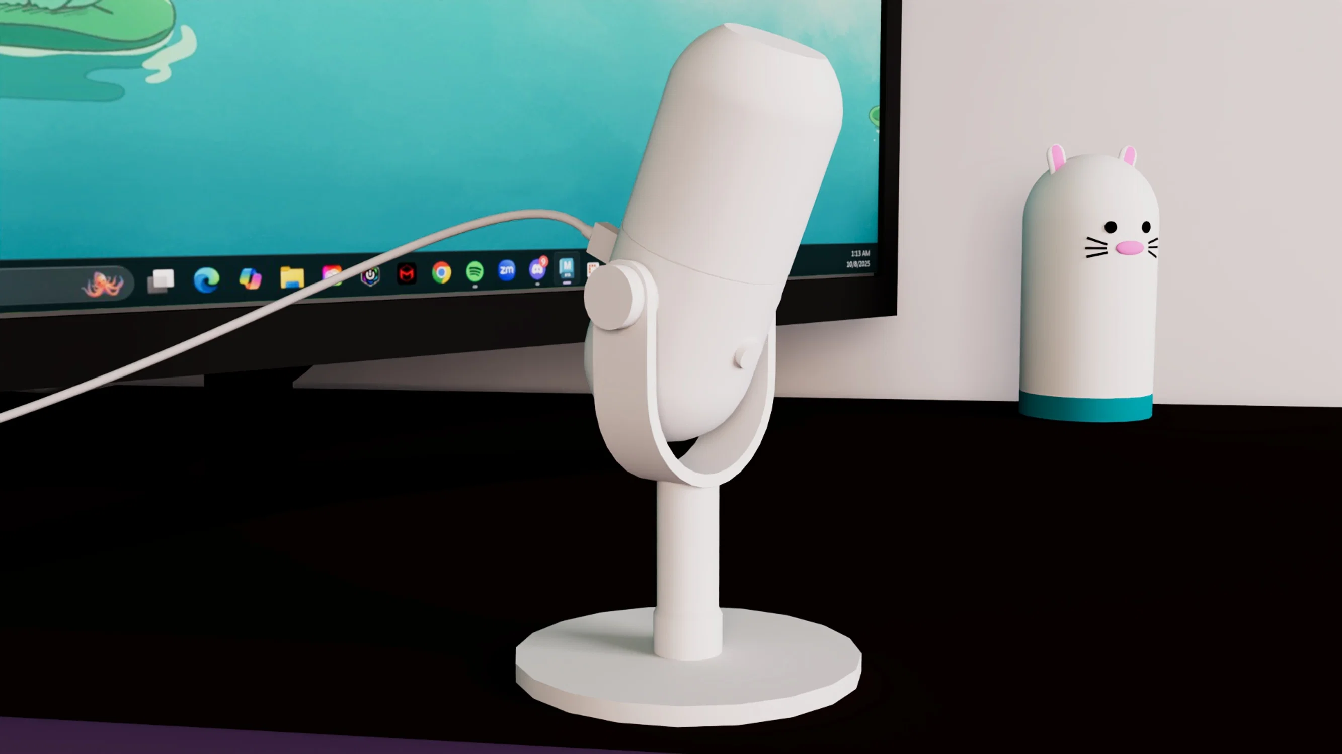 A white gaming mic with a mouse statue behind it.