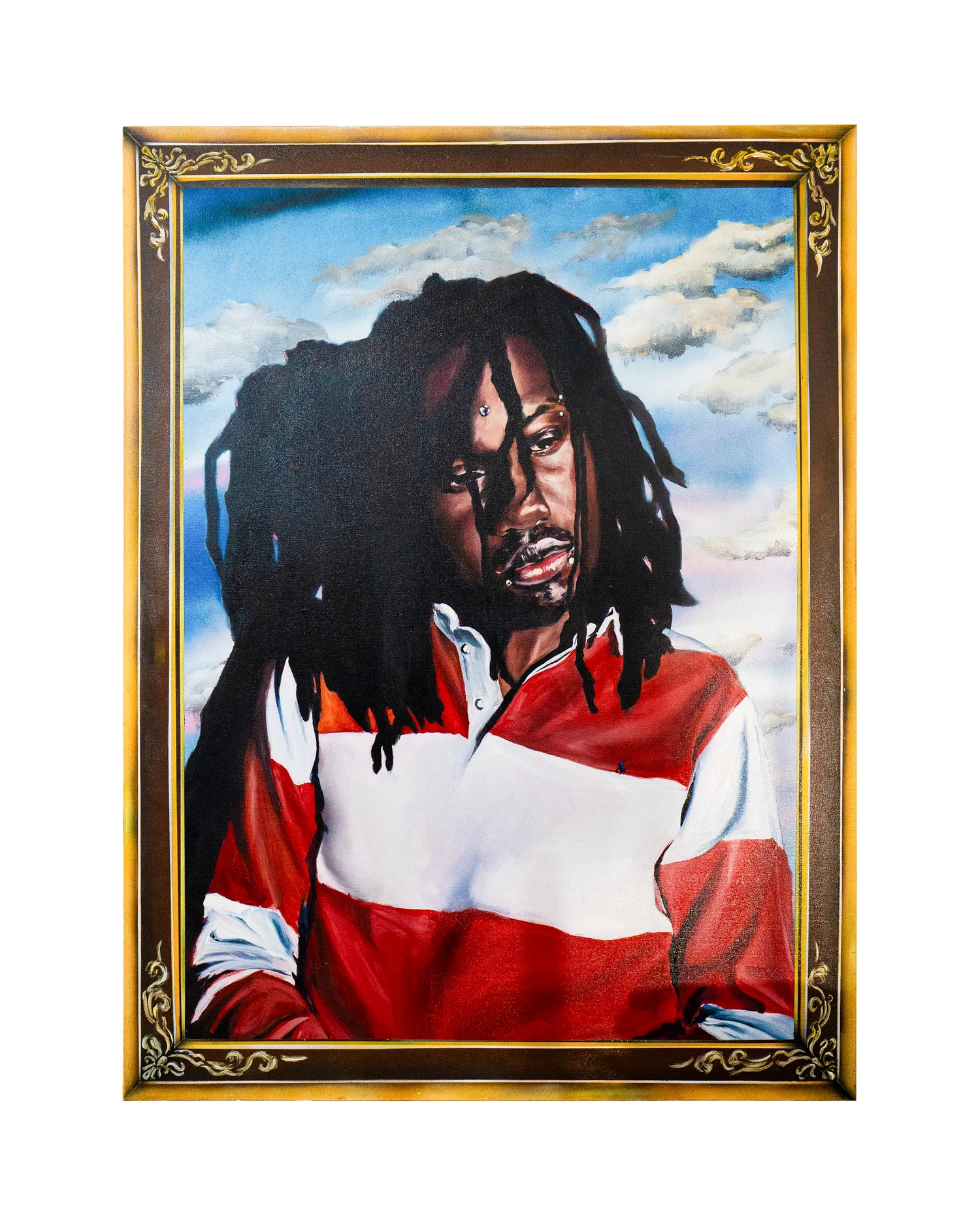 A framed portrait painting of a young Black man with long dreadlocks, shown from the chest up against a soft, cloudy sky background. He wears a red-and-white collared shirt, and his expression is calm and introspective, with his gaze directed slightly off to the side. The painting is rendered with smooth, realistic shading and subtle highlights on the face, while the ornate gold frame adds a formal, almost classical presentation that contrasts with the contemporary subject.