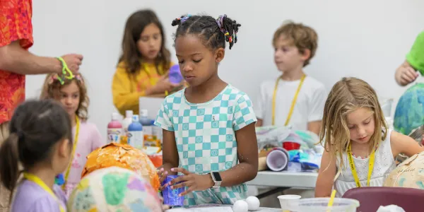 A group of Summer Youth Camp students working on their 3D art projects.