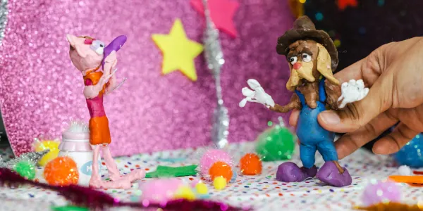 Stop motion animation set with one anthropomorphic bloodhound dog and one anthropomorphic character of ambiguous species