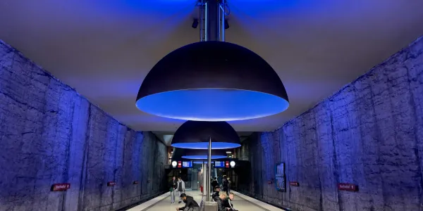 Large blue half-sphere iights illuminating a large room