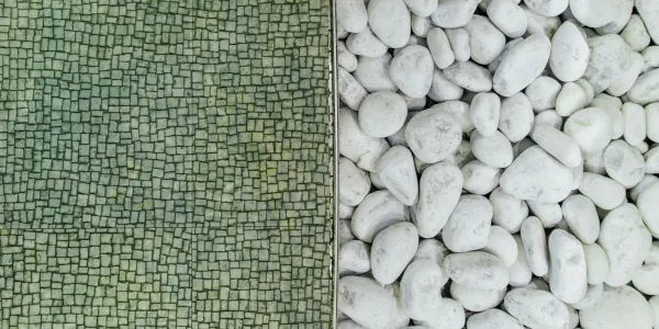 Examples of two design surfaces: small green tiles and white pebles