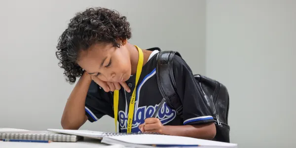 A Summer Youth Camp student working on a graphic design project