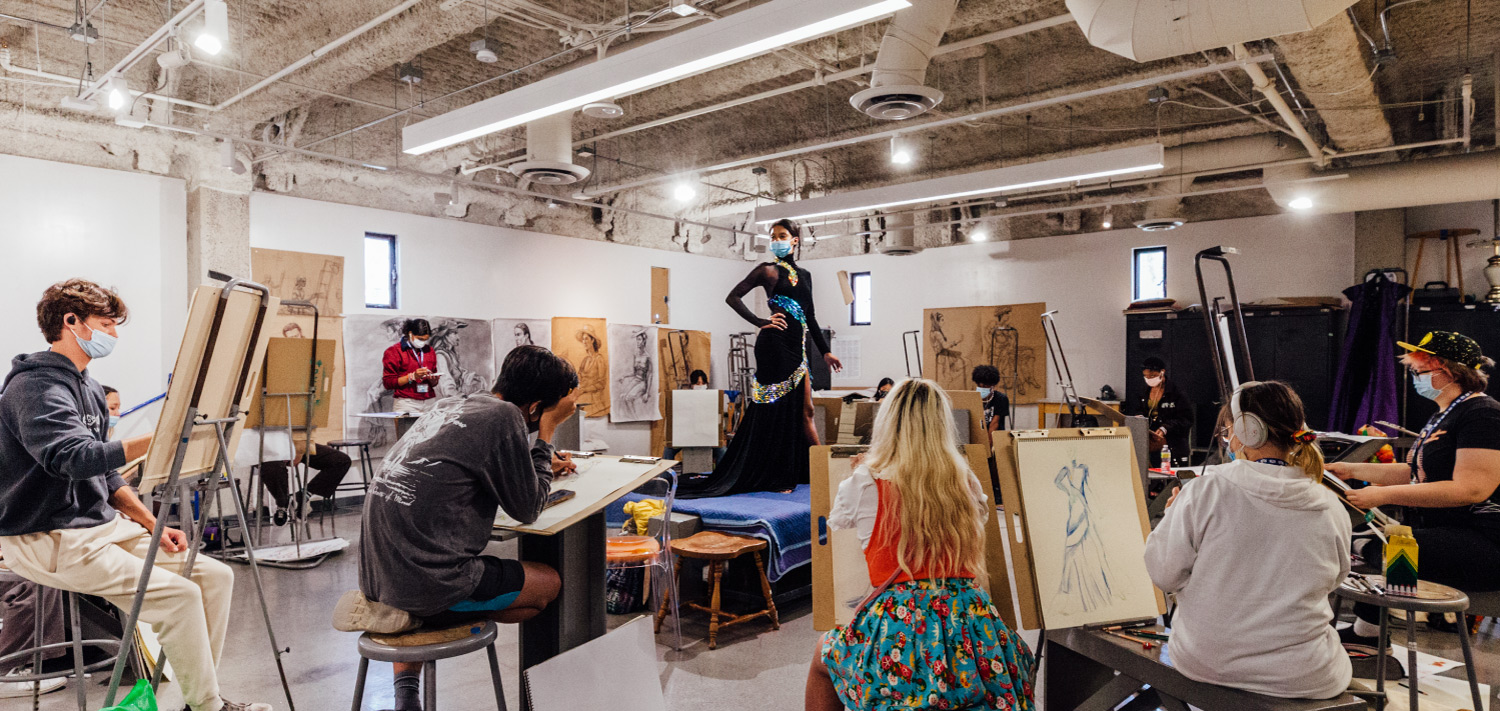 Students drawing in classroom