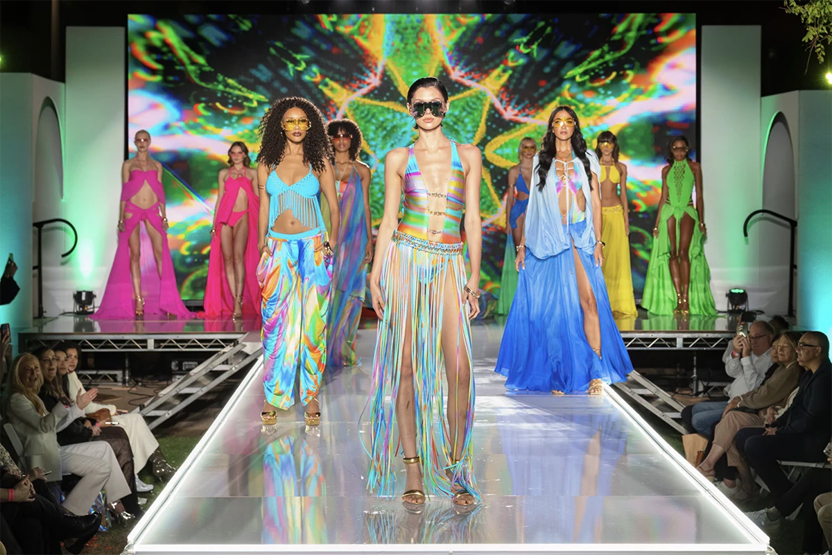 models wearing colorful outfits byeon the runway