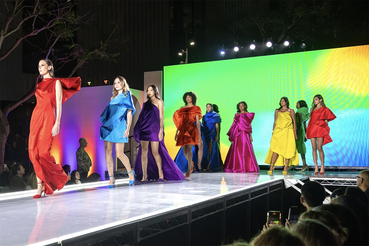 models on a runway wearing colorful outfits designed by David Meister