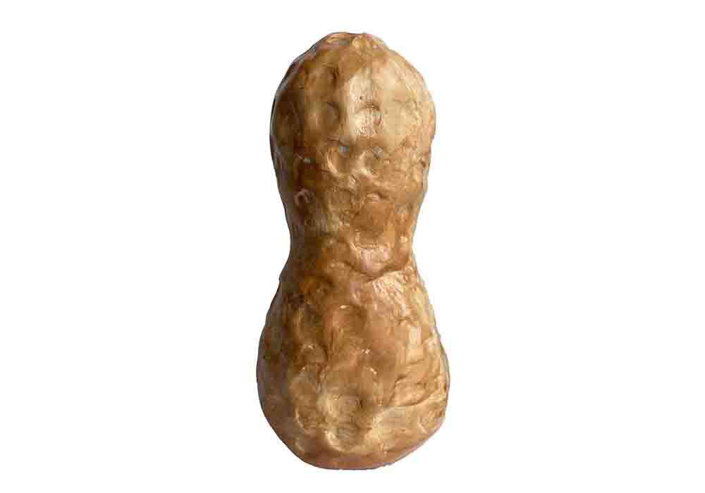 Ceramic sculpture of a peanut. 