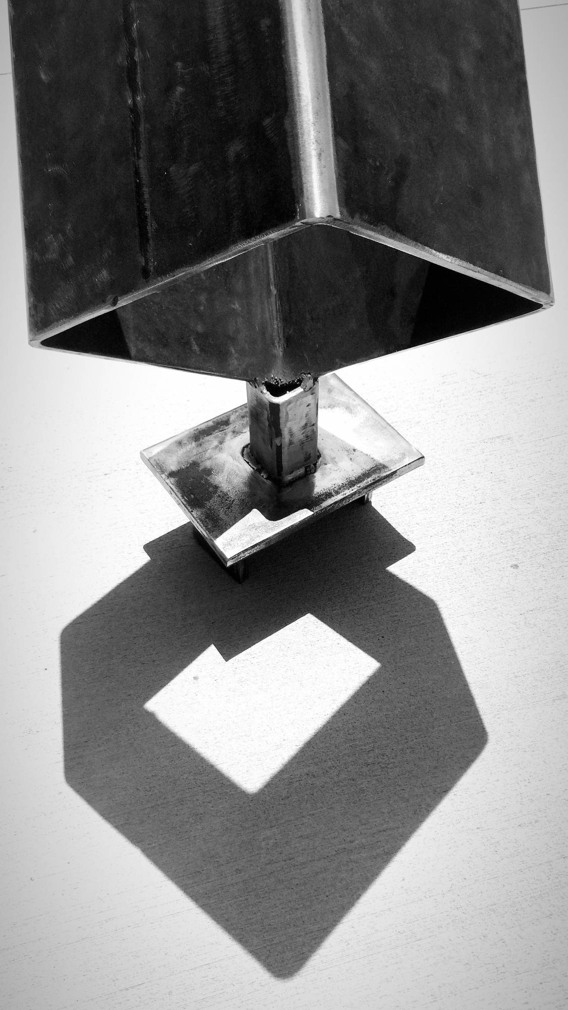 Slightly polished welded steel sculpture, hollow square.