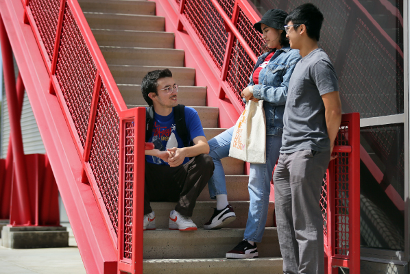 Students talking outside on stairs
