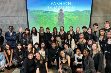 33 Los Angeles Fashion Week attendees pose in front of a 'Fashion Reimagined' screen