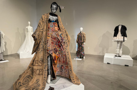 Female fashion mannequin wearing a dress and flowing cloak
