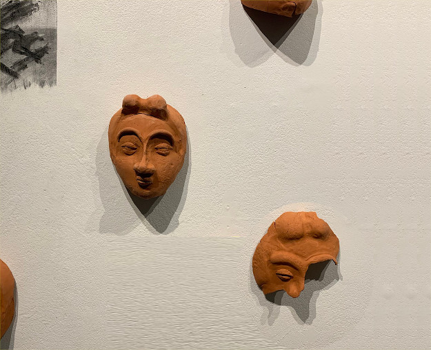 Mika Yokota: Legibility of a Human (Clay masks on a wall)