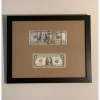Dollar bills cut and mounted in frame
