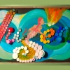 This is a 28 x 48 x 1/8 inches ( 71 x 122 x .125 cm ) made of Neocolor Watersoluble wax pastel and plastic bottle caps on 1/8 in wood panel. Here I give homage to the Japanese aesthetical meaning behind the word Yugen, "a profound, mysterious sense of the beauty of the universe and the sad beauty of human suffering." Our sad beauty is our possession to plastic, to oil. Plastic in our life is how we attempt to either fire our nature even though we try to turn off the fire. 