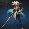"Angelic looking woman with sweeping blonde hair.  Has glowing blue ""wings"" and holding a sword."