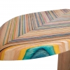 dynamically shaped side tables that feature multicolored striped wood tops that are constructed out of the recycled wood from three skateboards