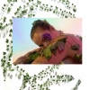 Digital composite image of a young woman with ivy on her body and ivy vines in background.