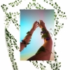 Digital composite image of two arms with ivy twisted around them and ivy vines in background.